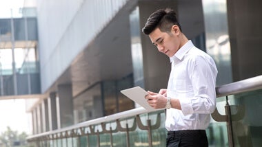 Asian businessman using tablet