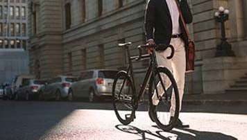 man walking with bicycle
